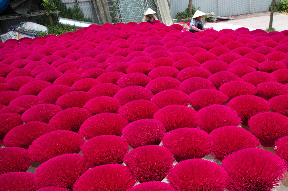 Streets in the villages are filled with bunches of blazed red and pink incense sticks